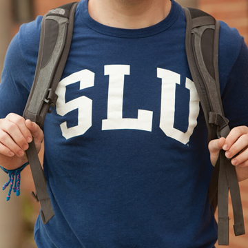 person wearing SLU shirt